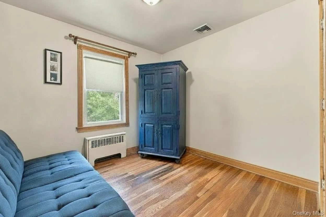 Third bedroom with hardwood floors Third bedroom with hardwood floors