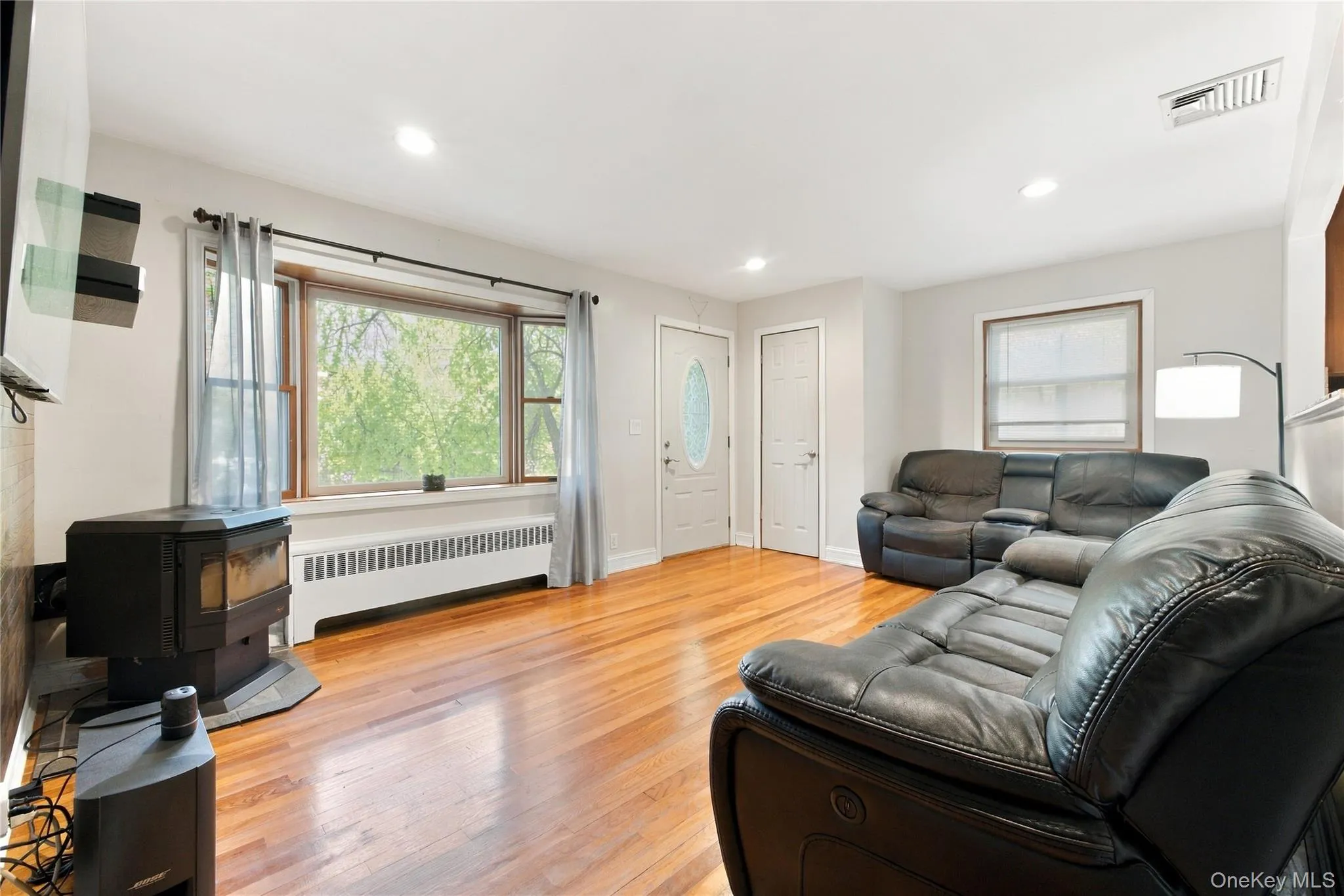 Living Room with bay window, recess lighting and hardwood floors. Living Room with bay window, recess lighting and hardwood floors.