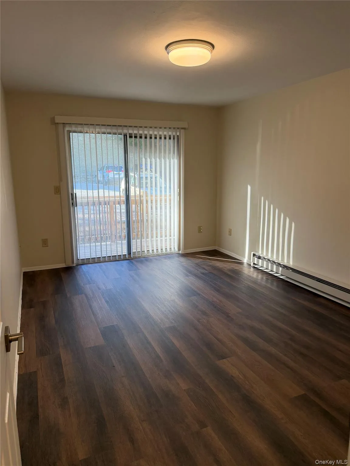 Wood-finish vinyl flooring, sliding glass door to balcony. Wood-finish vinyl flooring, sliding glass door to balcony.