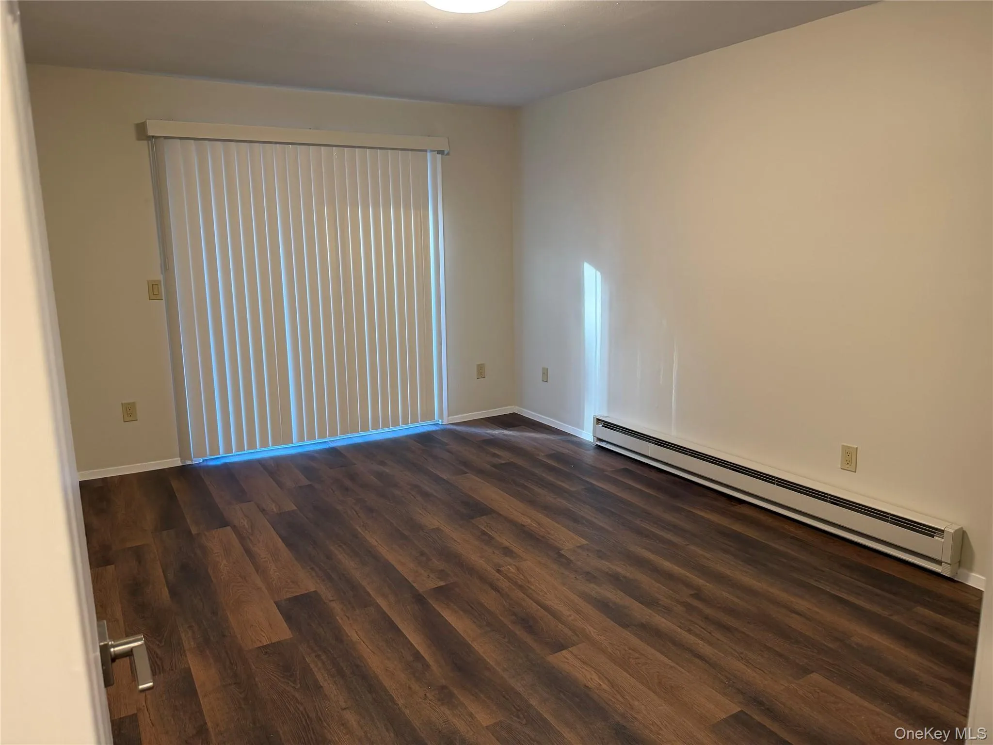 Wood-finish vinyl flooring with a neutral wall color. Wood-finish vinyl flooring with a neutral wall color.