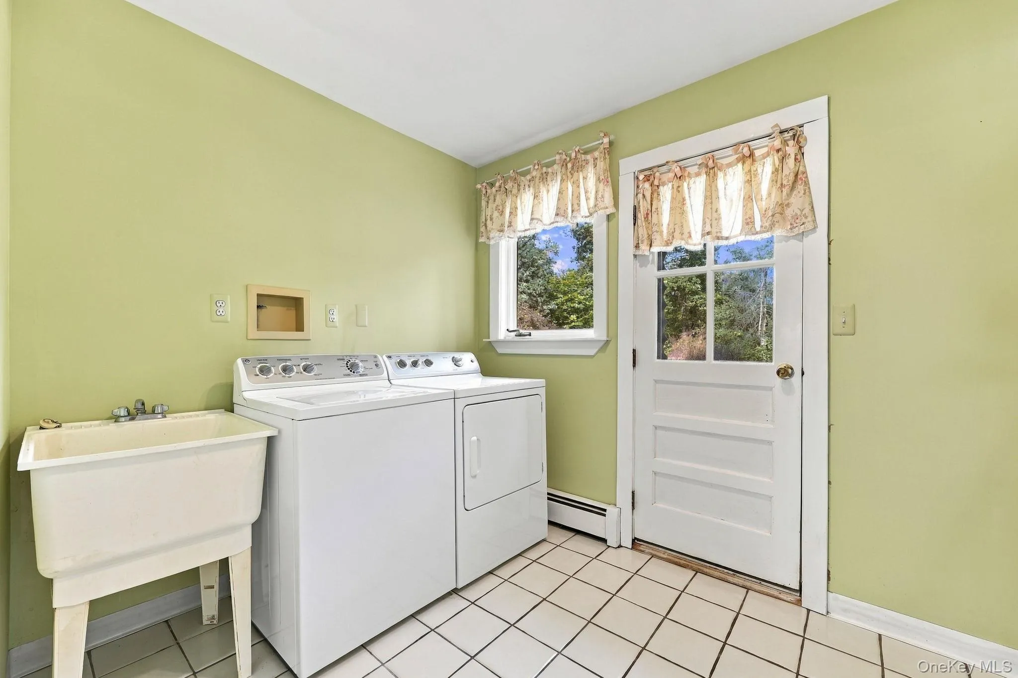 Laundry room leads out to backyard Laundry room leads out to backyard