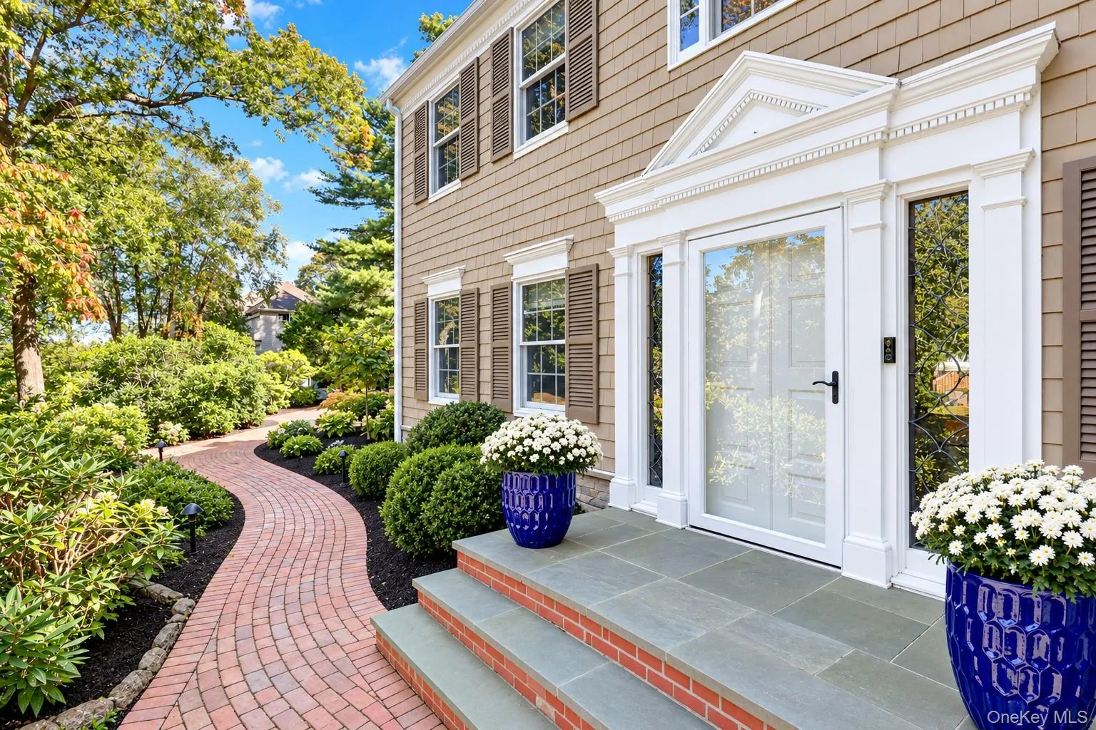 Welcoming Front Entrance With Brick Walkway & Bluestone Steps Welcoming Front Entrance With Brick Walkway & Bluestone Steps