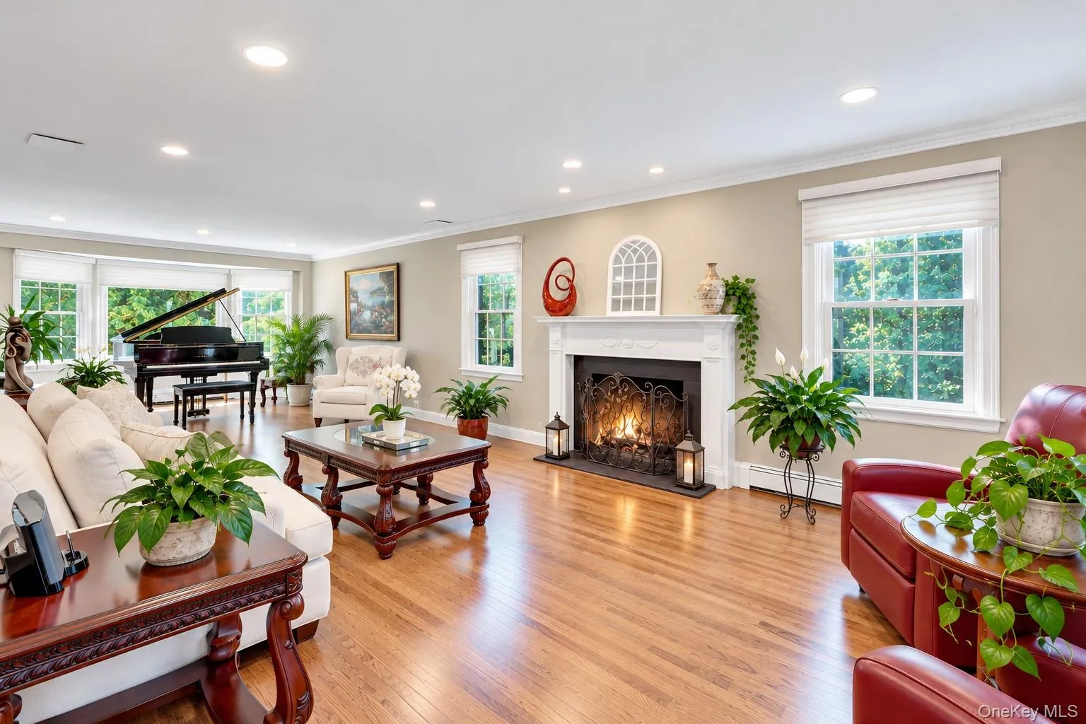 Formal Living Room With Fireplace, Hardwood Floors, and Beautiful Views of Nature Formal Living Room With Fireplace, Hardwood Floors, and Beautiful Views of Nature