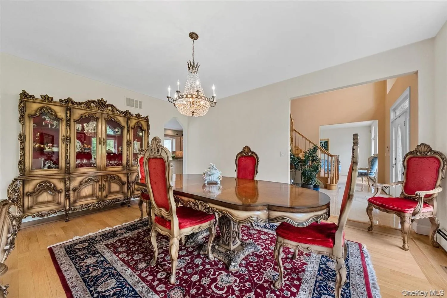 Dining area with light wood finished floors, arched walkways, and hanging lights Dining area with light wood finished floors, arched walkways, and hanging lights