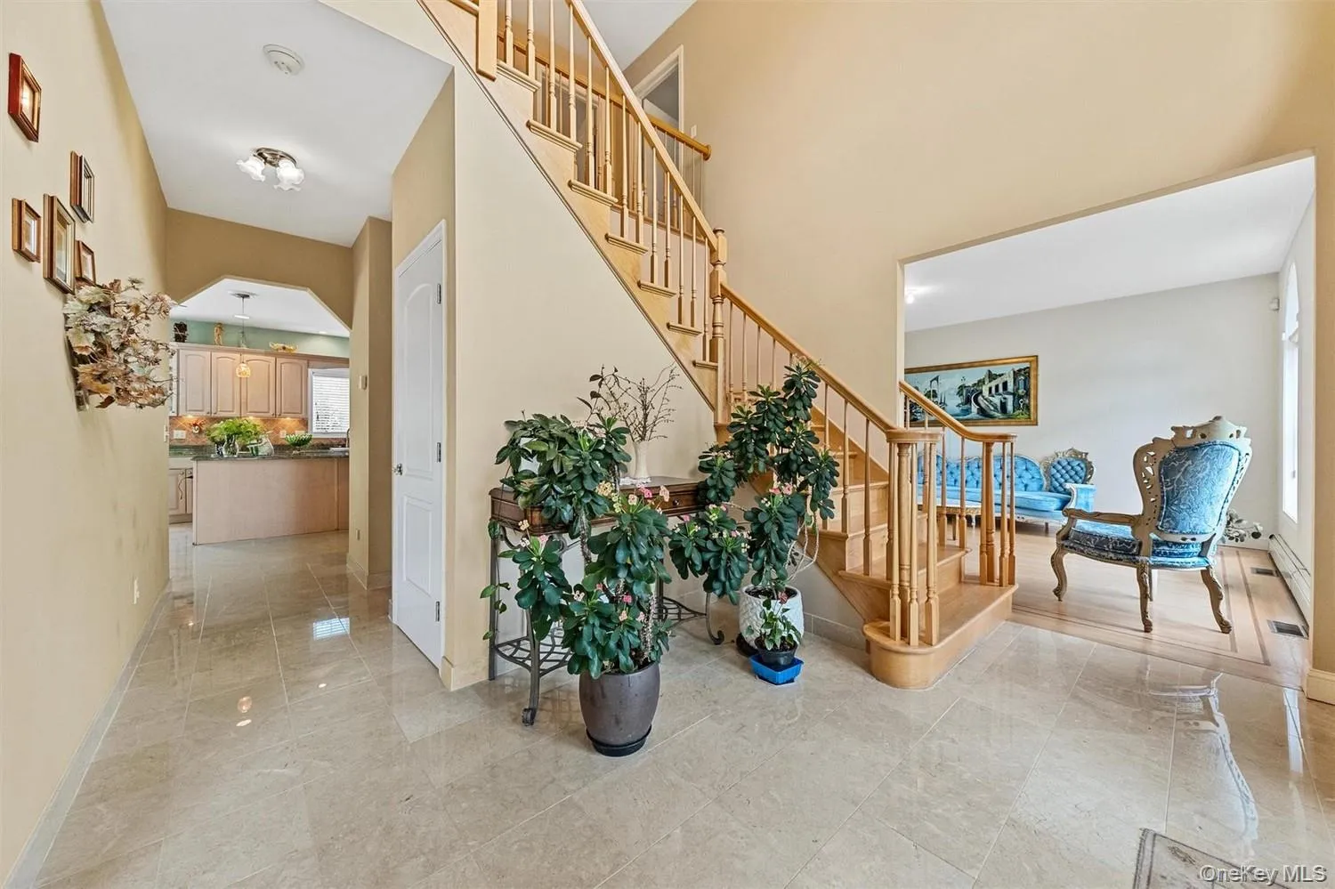 Stairway featuring arched walkways and a high ceiling Stairway featuring arched walkways and a high ceiling