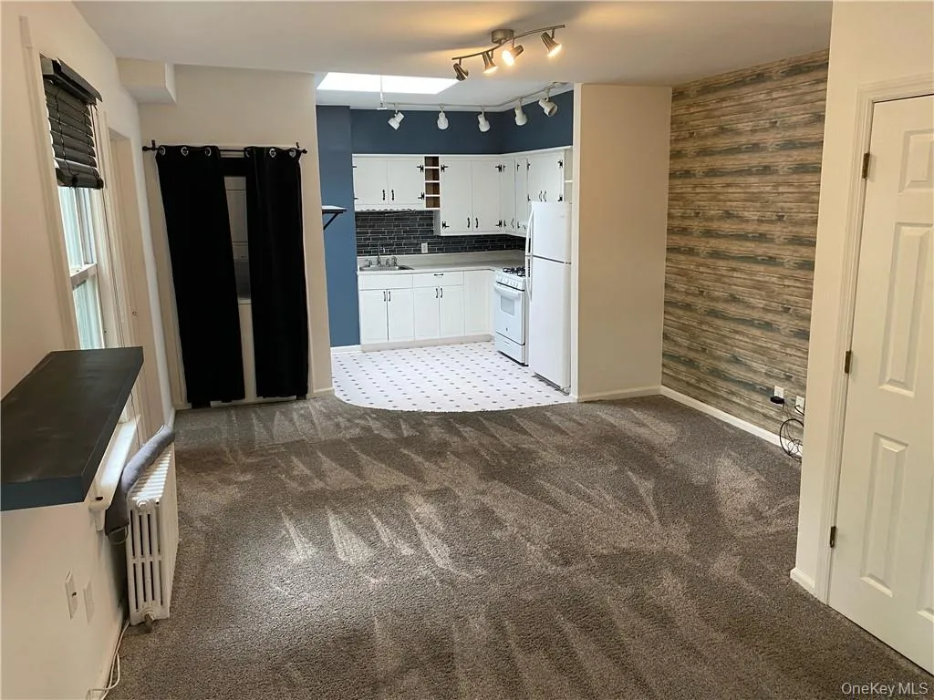 Kitchen with skylight opens to living room Kitchen with skylight opens to living room