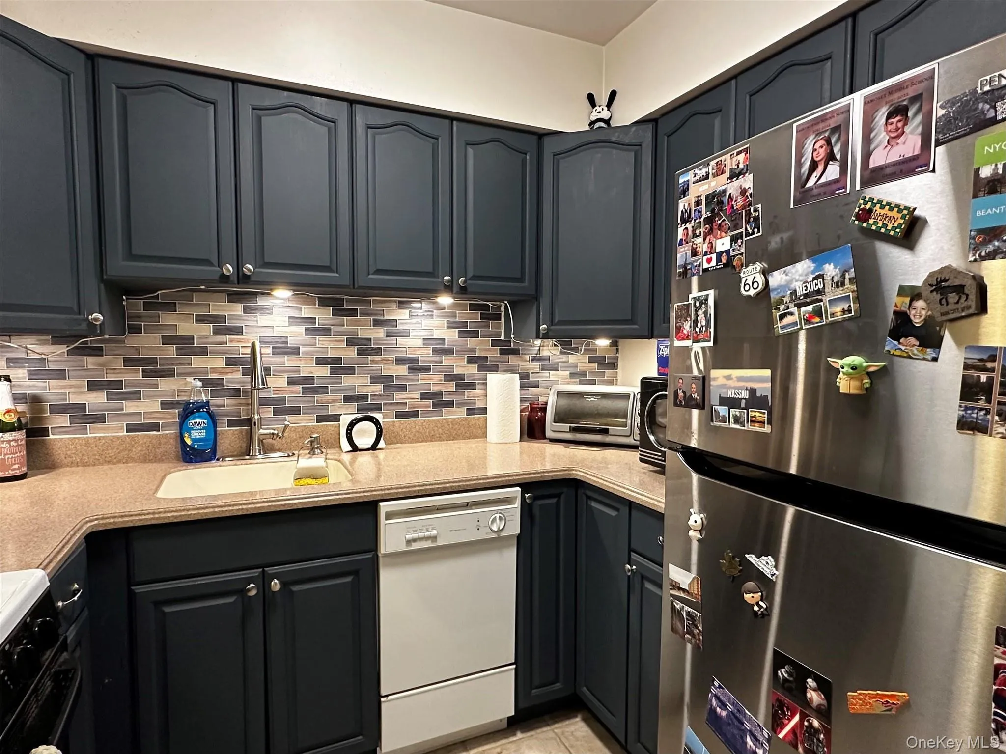Kitchen with new stainless steel refrigerator Kitchen with new stainless steel refrigerator