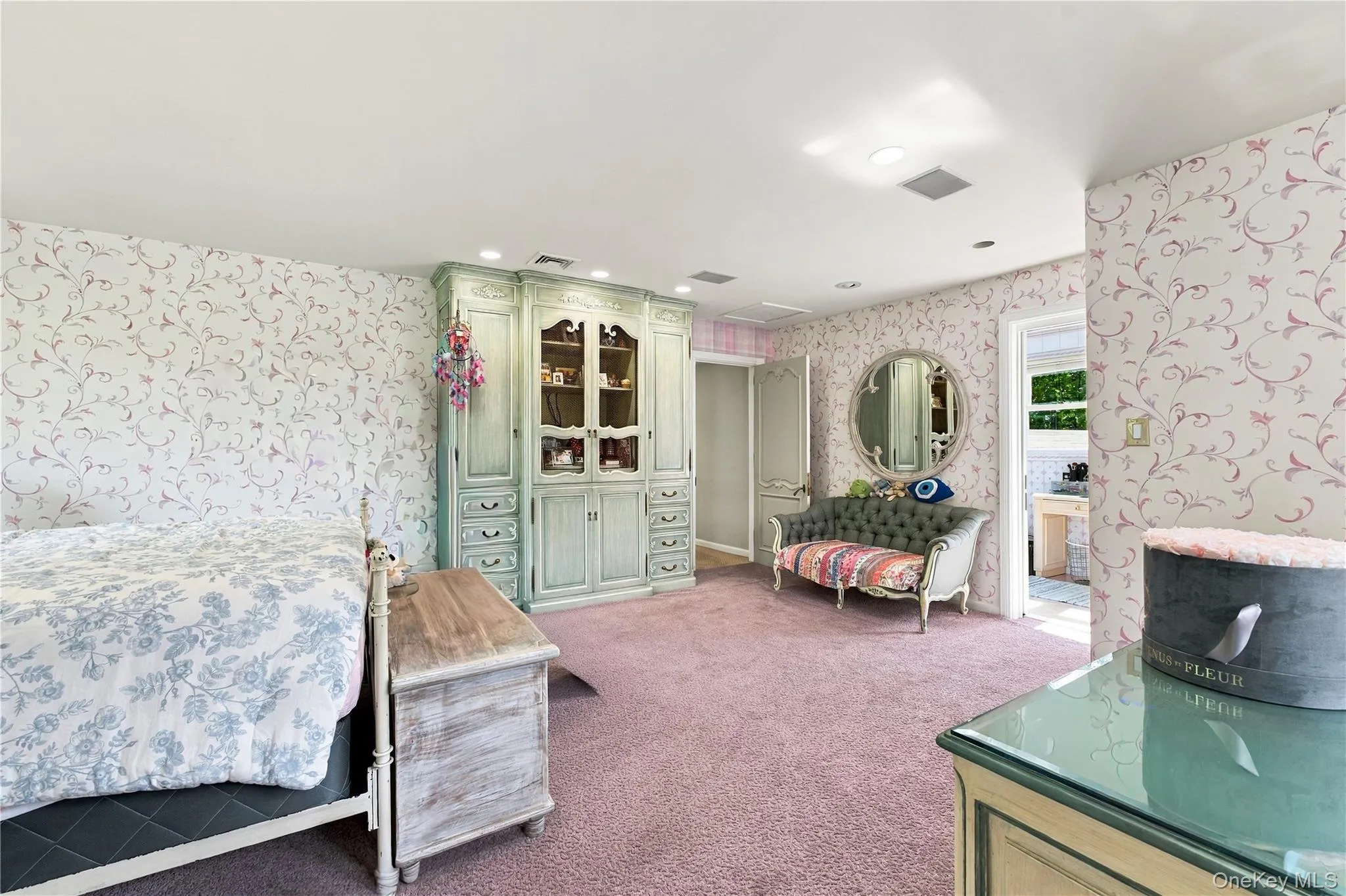 Built-in floor-to-ceiling cabinetry, recessed lighting, and patterned wall coverings Built-in floor-to-ceiling cabinetry, recessed lighting, and patterned wall coverings