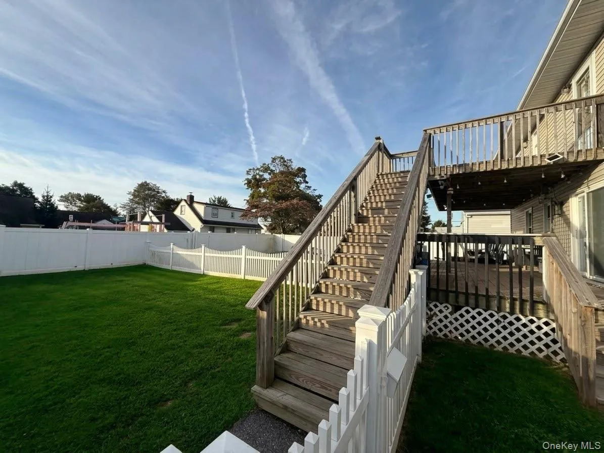 Private entrance and fenced yard Private entrance and fenced yard