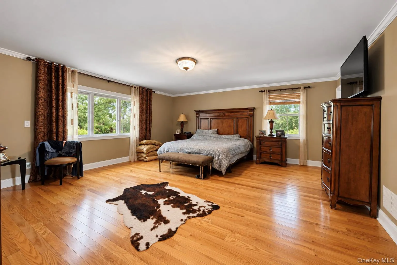 Wood-finish flooring, multi-pane windows, and crown molding Wood-finish flooring, multi-pane windows, and crown molding