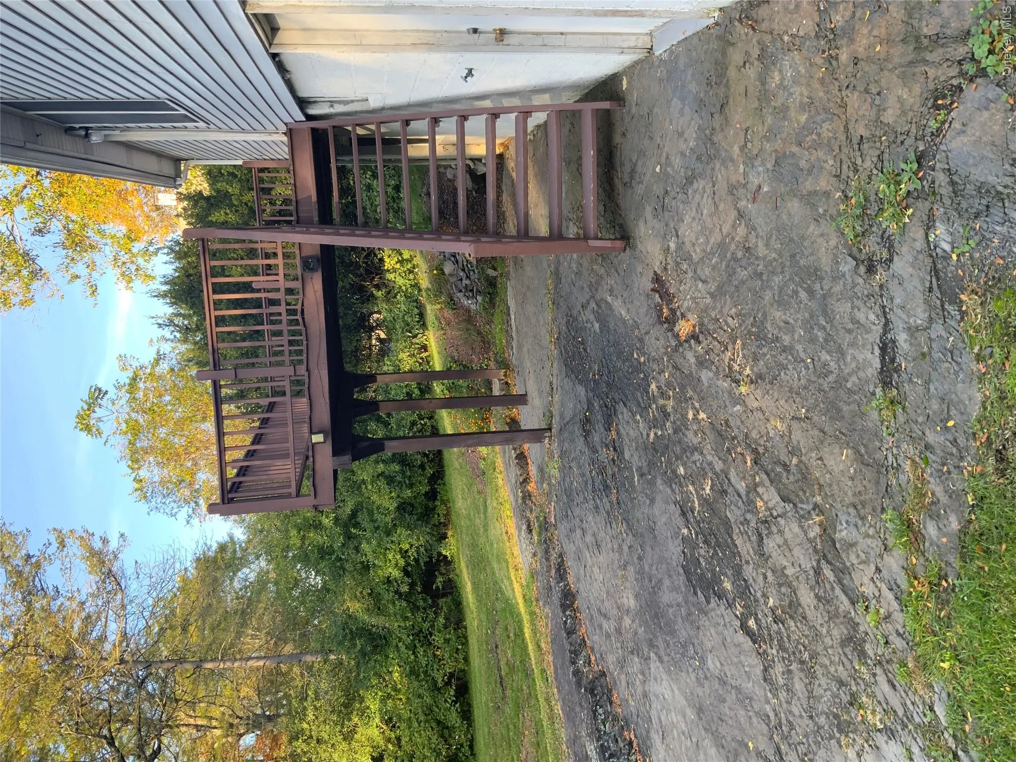 Natural stone patio structure on lower level with walkout from basement Natural stone patio structure on lower level with walkout from basement