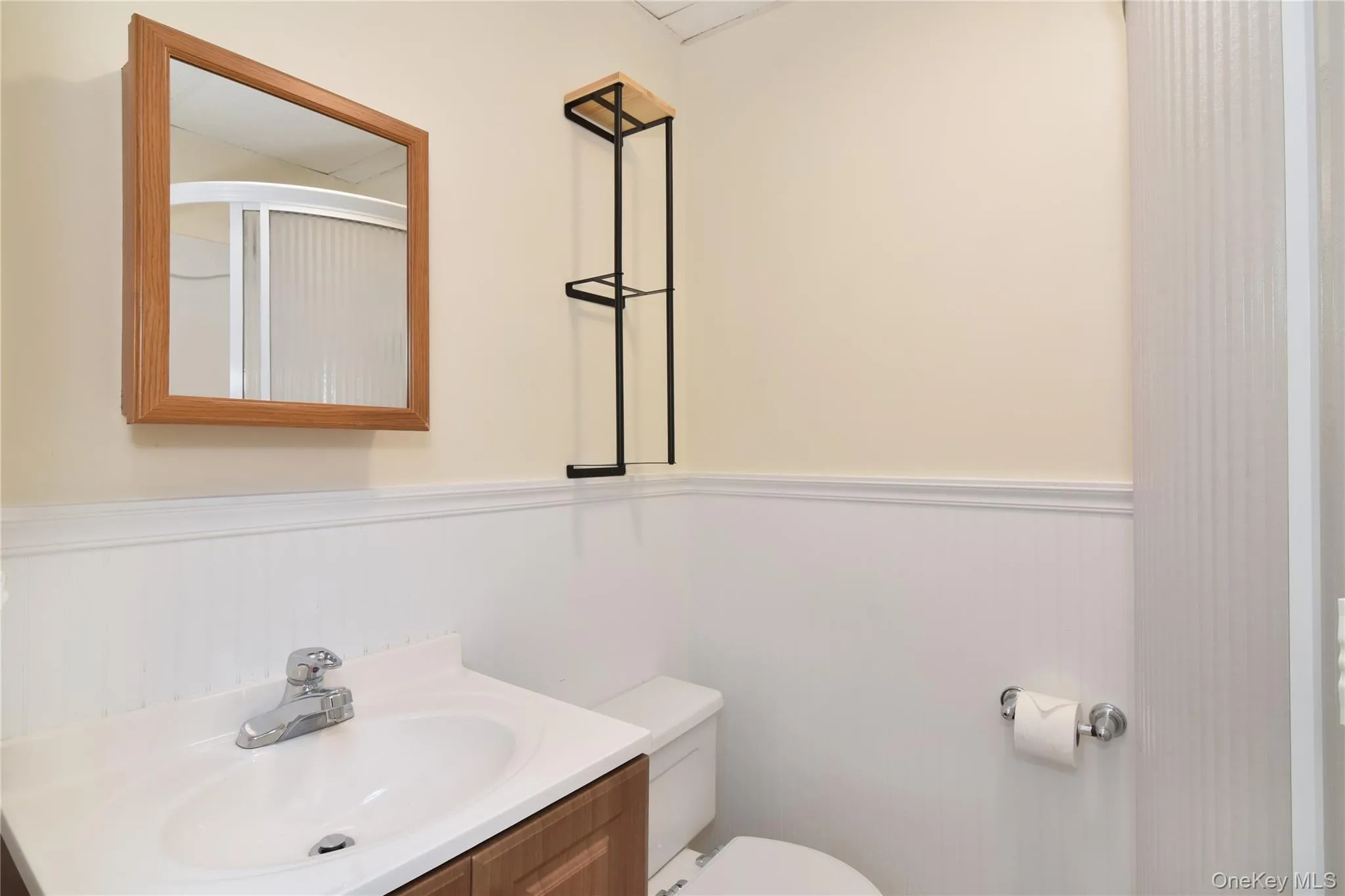 Full bathroom featuring vanity storage. Full bathroom featuring vanity storage.