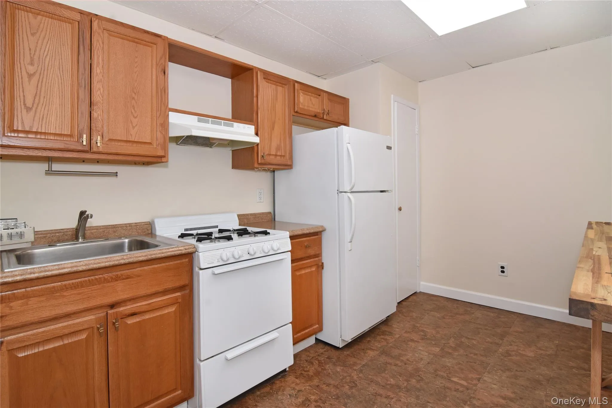 Another view of the kitchen with access to a pantry closet. Another view of the kitchen with access to a pantry closet.