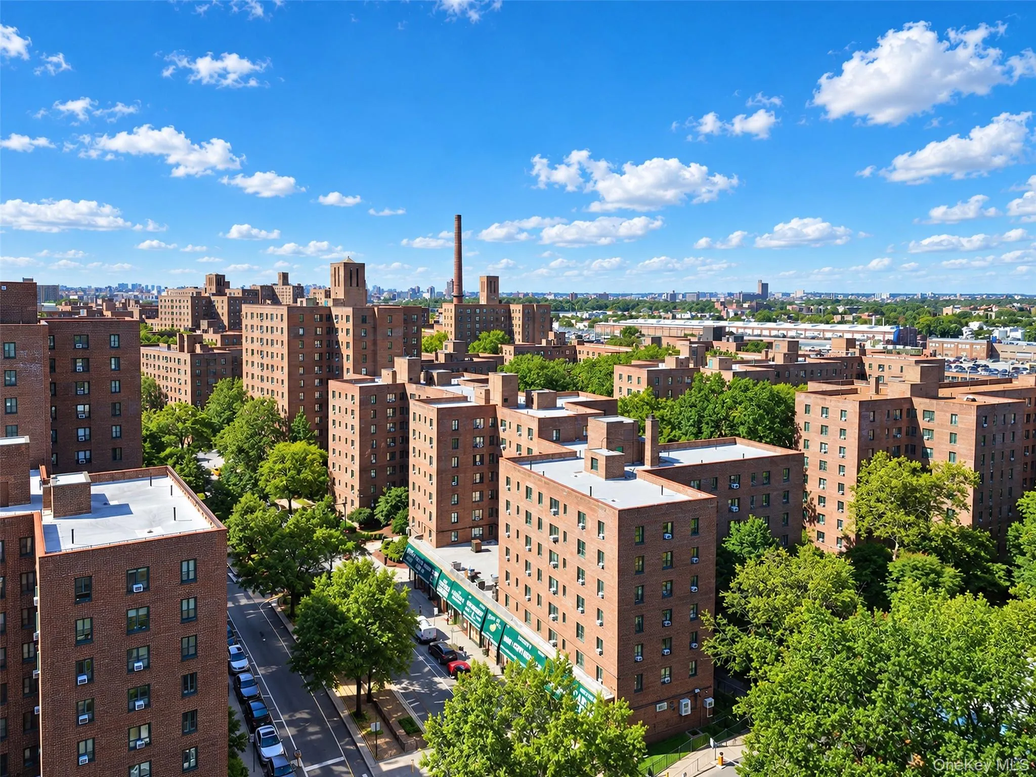 Aerial perspective showcasing urban surroundings, brick multi-story architecture, and established tree canopy Aerial perspective showcasing urban surroundings, brick multi-story architecture, and established tree canopy
