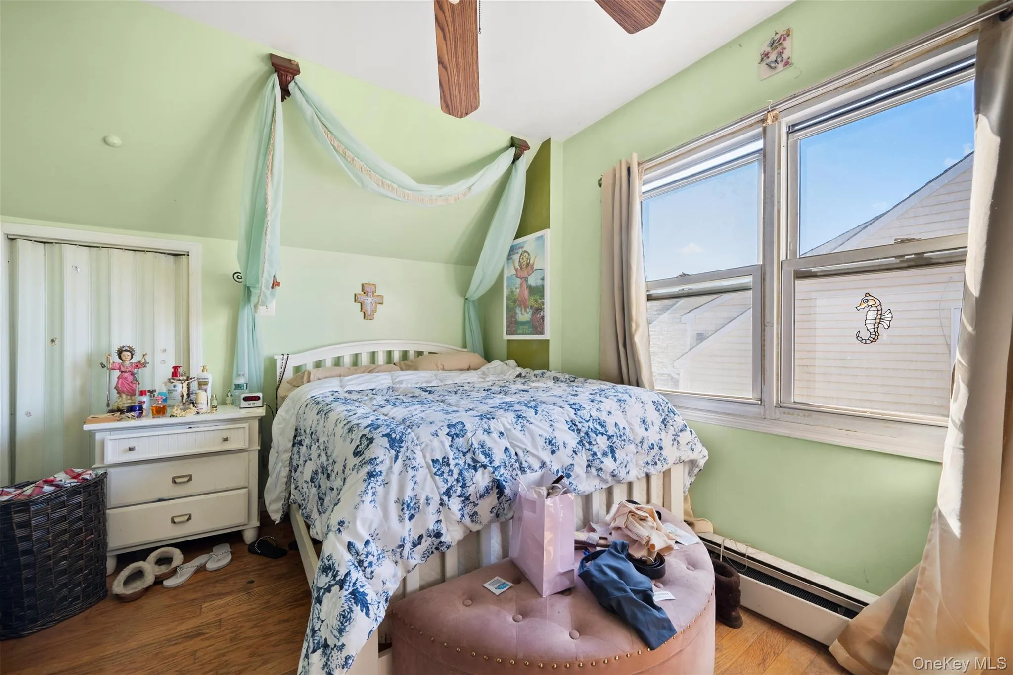 Second floor BR4: Sloped ceilings, wood-finish flooring, and large window with dual panes Second floor BR4: Sloped ceilings, wood-finish flooring, and large window with dual panes