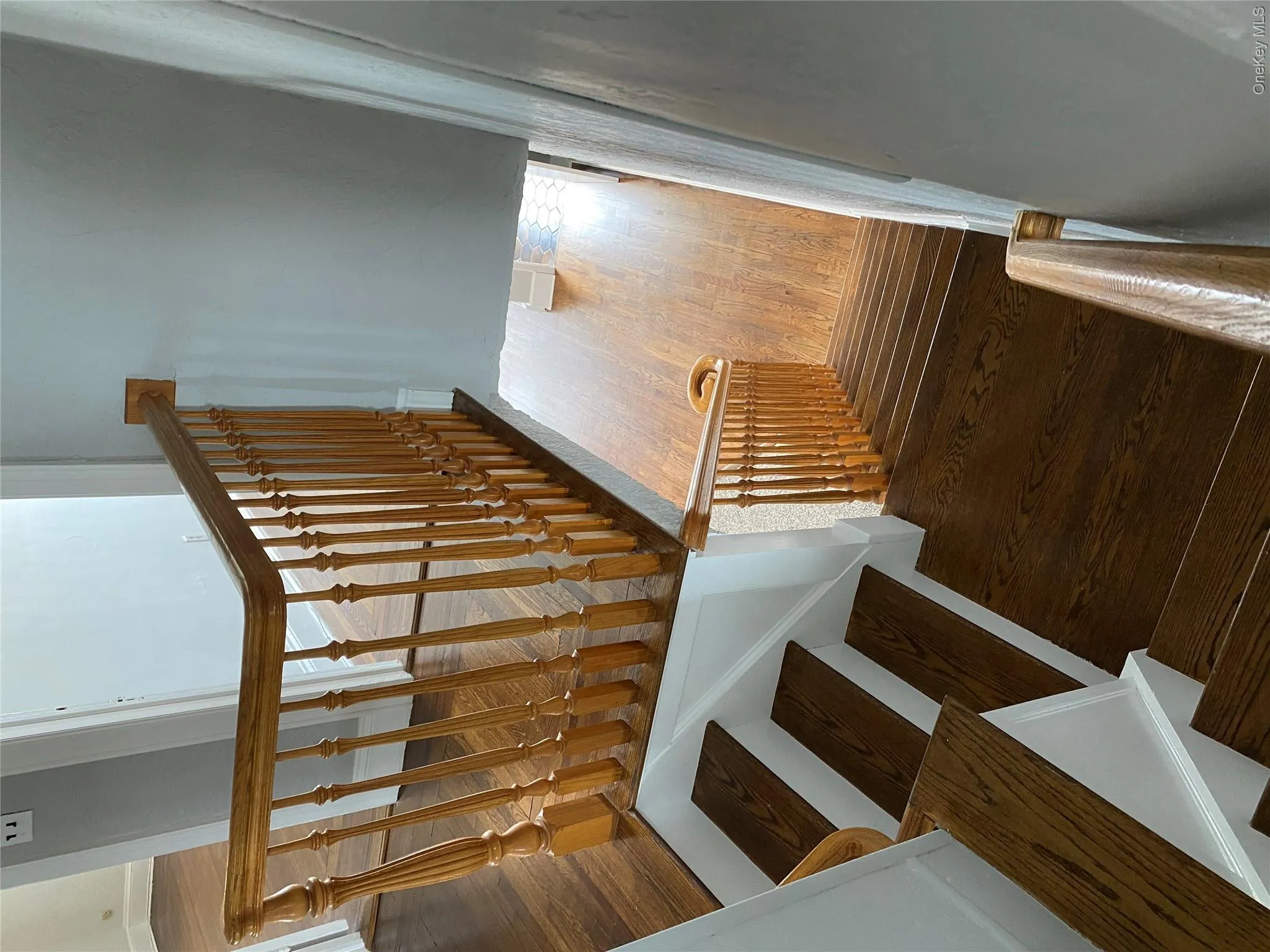 Stairs with wood finished floors and baseboards Stairs with wood finished floors and baseboards