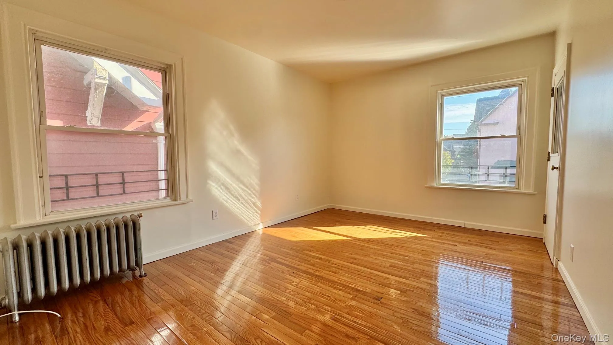 Large living room w/ refinished floors, tons of south facing sunlight, & a deep closet. Large living room w/ refinished floors, tons of south facing sunlight, & a deep closet.