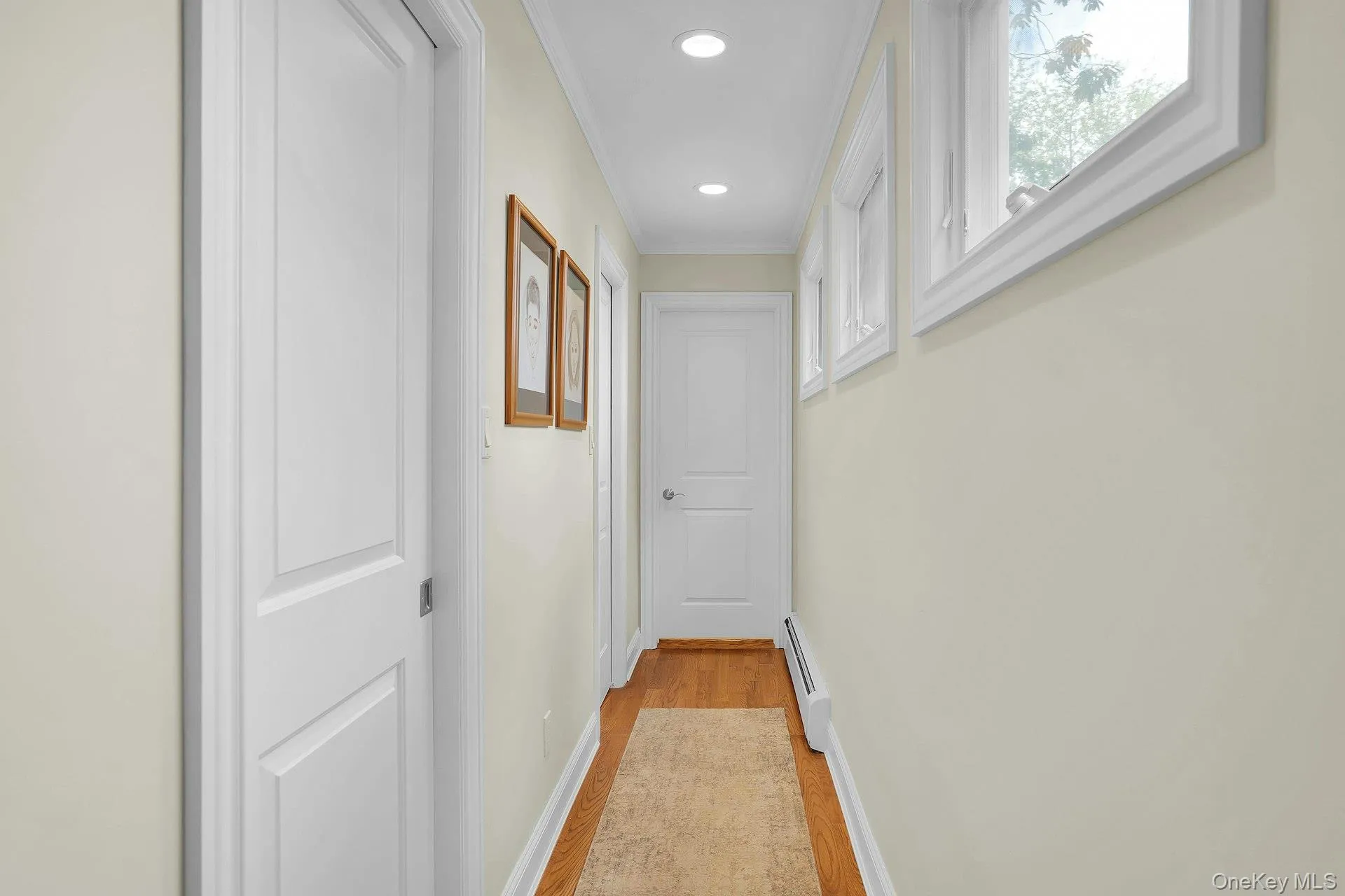 Hallway leads to 2 walk-in-closets and primary bathroom. Hallway leads to 2 walk-in-closets and primary bathroom.