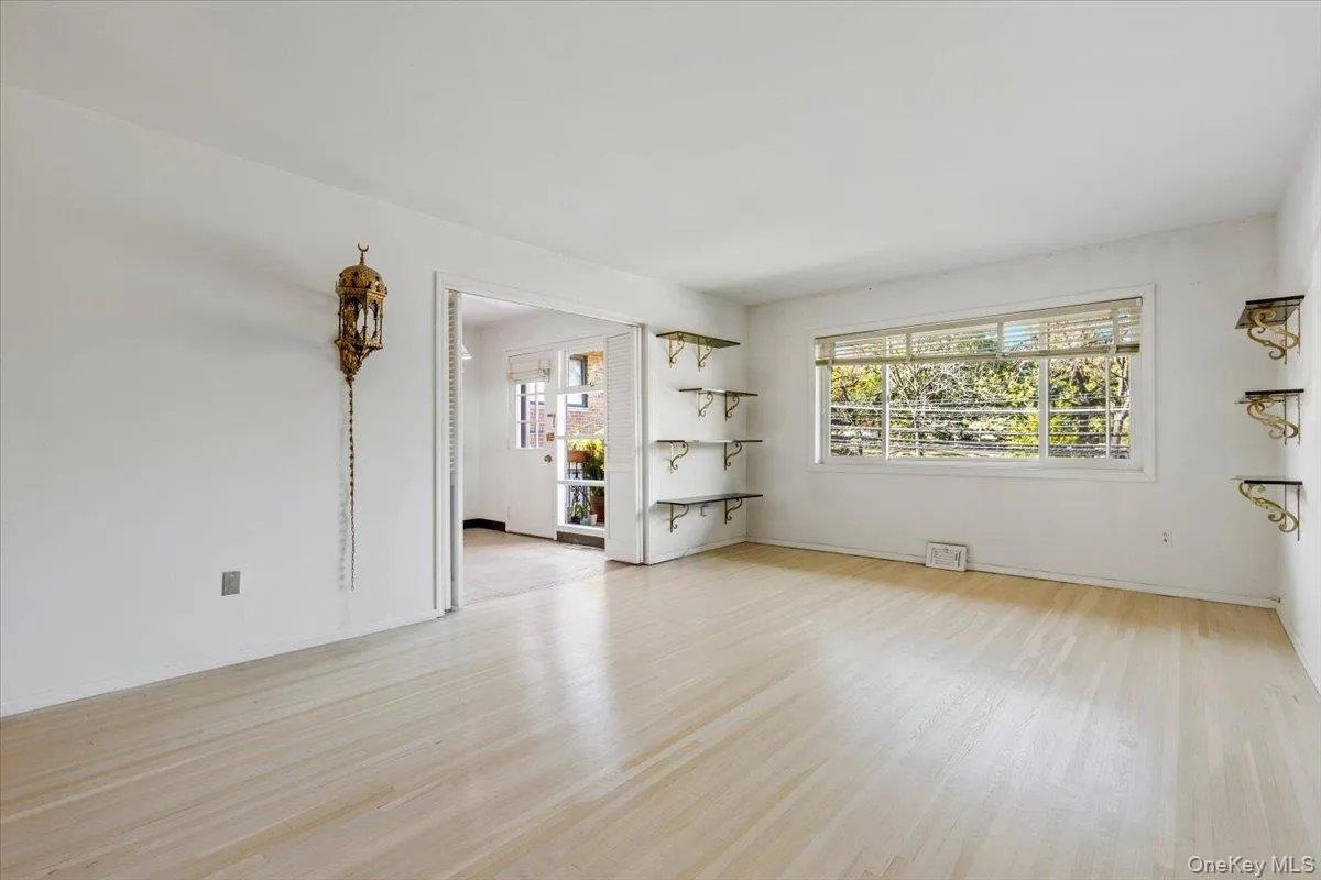 Living room has door access to eat-in kitchen Living room has door access to eat-in kitchen