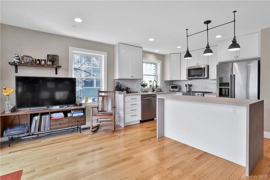 Living/playing area, hardwood floors Living/playing area, hardwood floors