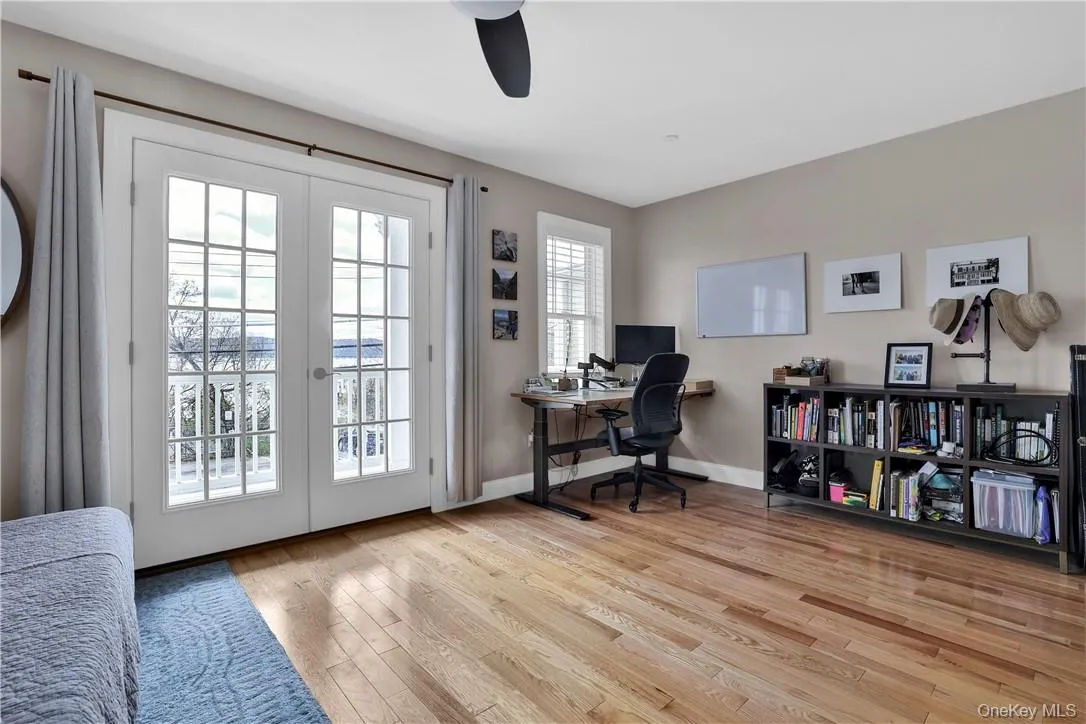 Primary bedroom, French doors to balcony Primary bedroom, French doors to balcony