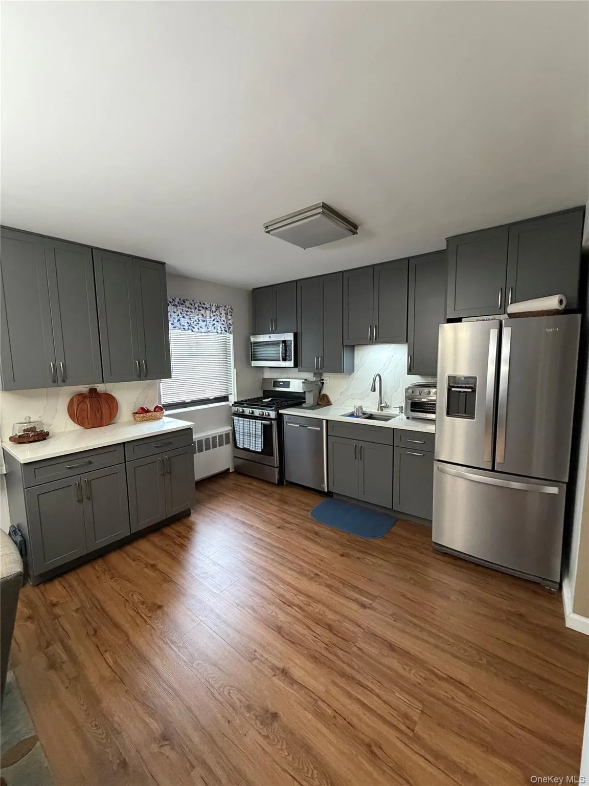 Chef's Open Concept Kitchen New Stainless Steel Appliances New Floor Quartz Countertops Chef's Open Concept Kitchen New Stainless Steel Appliances New Floor Quartz Countertops