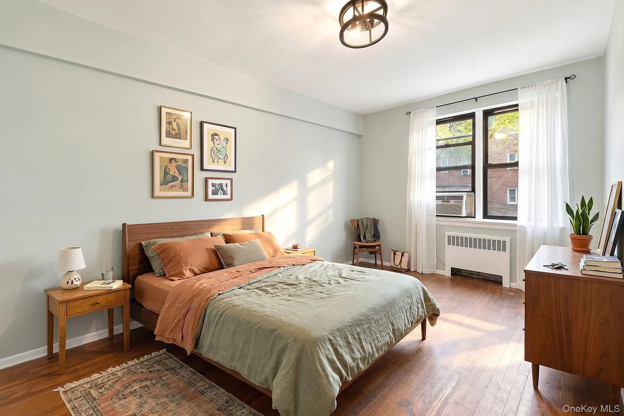 Large second bedroom with hardwood floors that need TLC Large second bedroom with hardwood floors that need TLC
