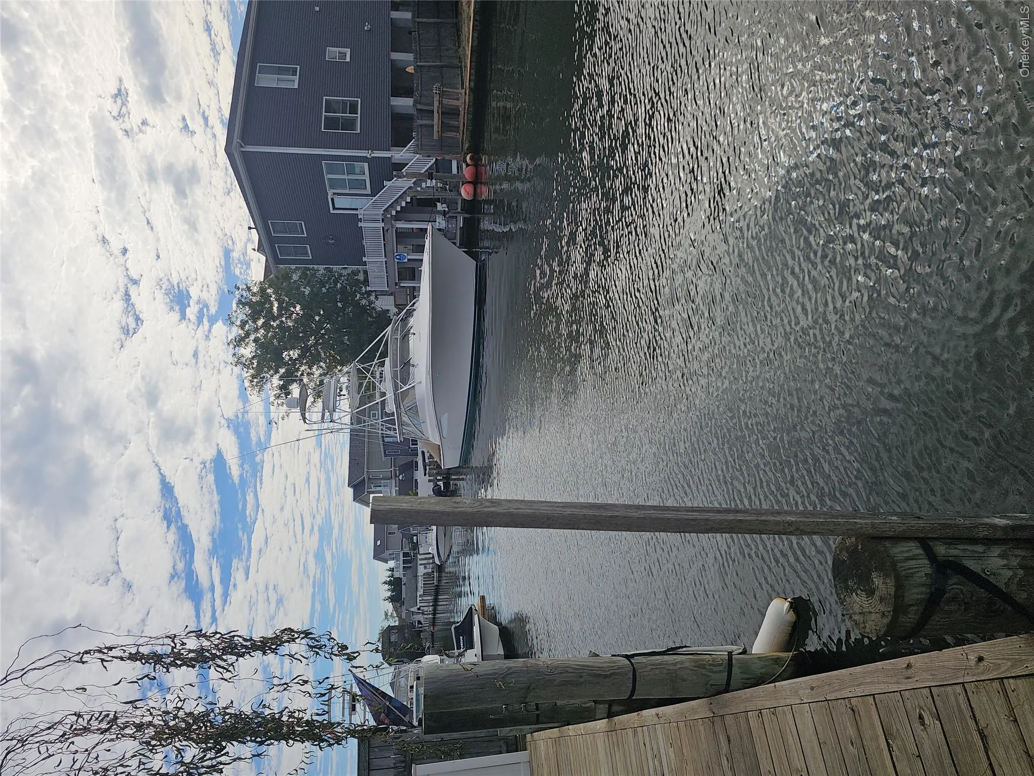 Waterfront property featuring a wood-plank bulkhead and pilings Waterfront property featuring a wood-plank bulkhead and pilings
