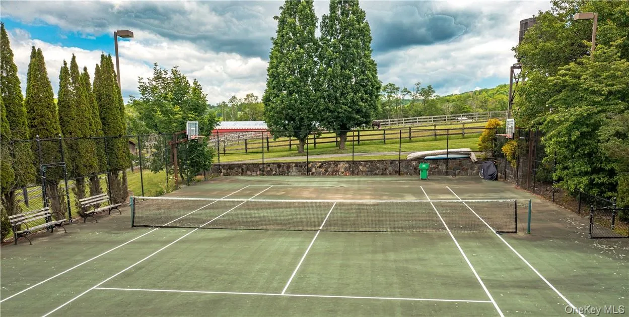 Tennis court is shared between the main estate and the guest cottage. Tennis court is shared between the main estate and the guest cottage.