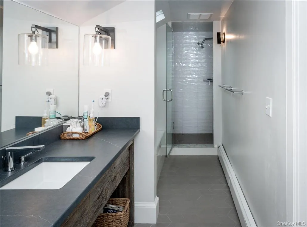 Primary bathroom with walk-in shower and tub. Primary bathroom with walk-in shower and tub.