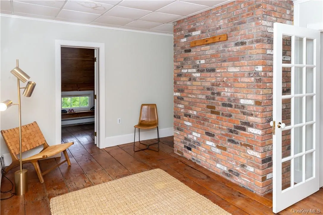 Sitting area leads to a walk-in closet. Sitting area leads to a walk-in closet.