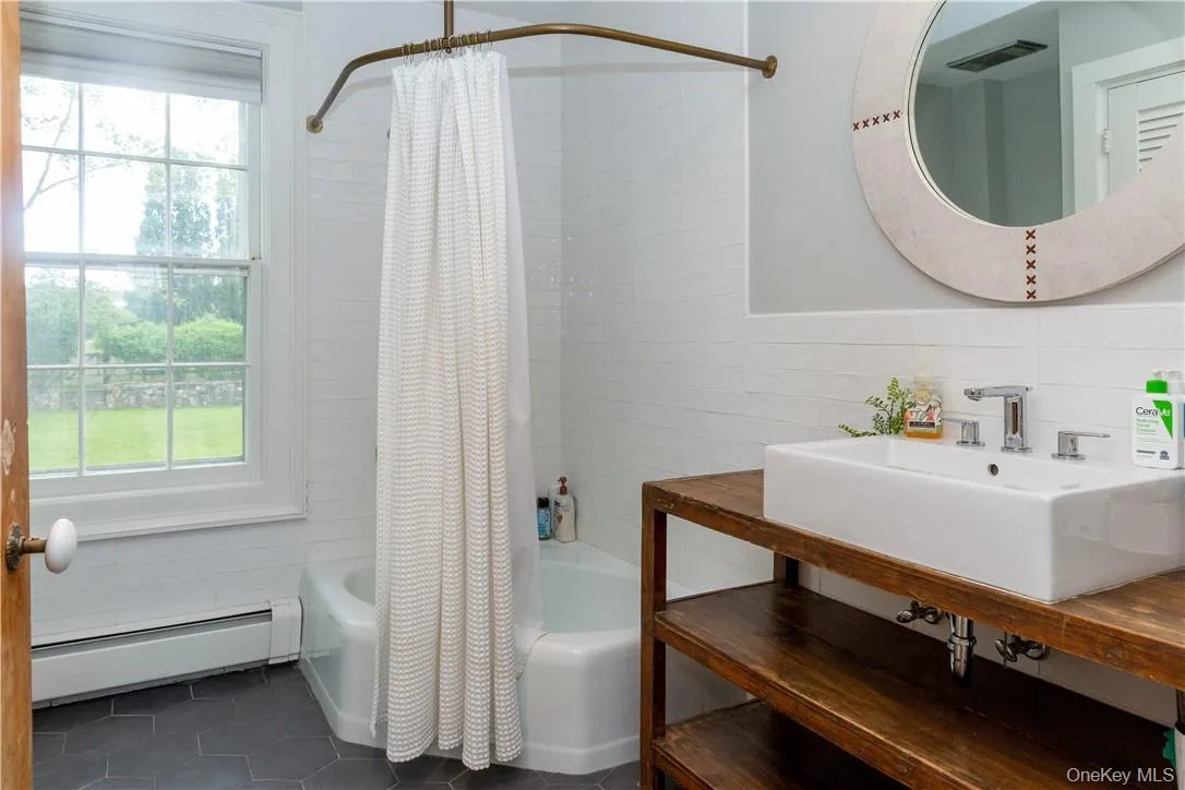 Hall bath for the second and third bedrooms. Hall bath for the second and third bedrooms.