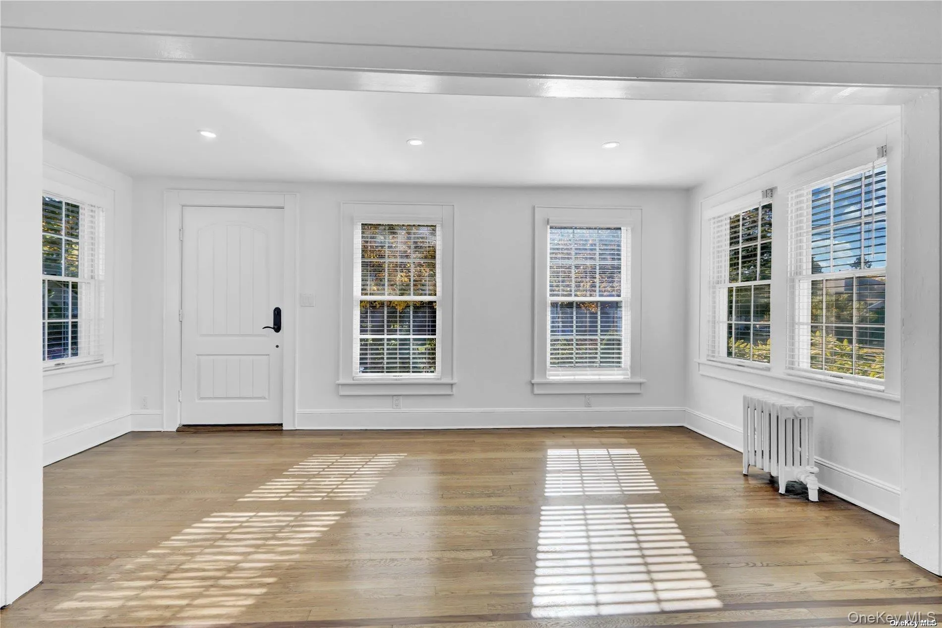 Front door entry, den, refinished hardwood floors Front door entry, den, refinished hardwood floors