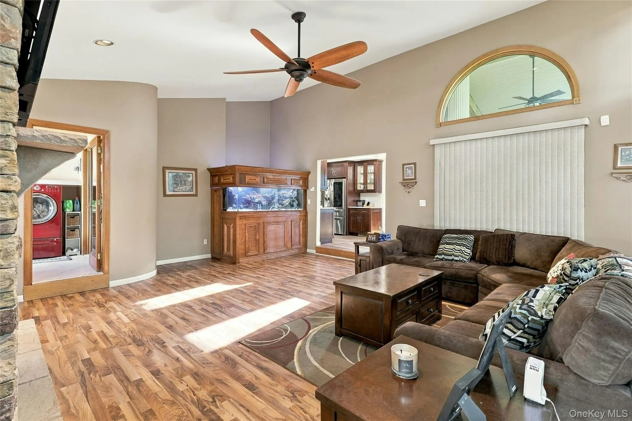 Vaulted ceilings, wood-finish flooring, arched transom window, built-in cabinetry, and recessed lighting Vaulted ceilings, wood-finish flooring, arched transom window, built-in cabinetry, and recessed lighting