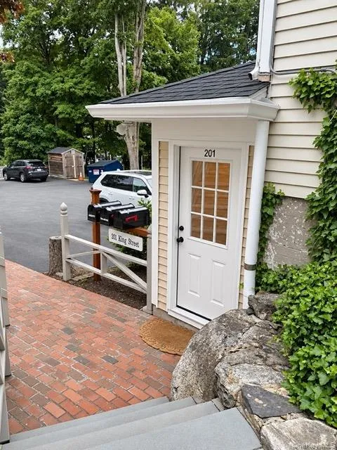 Rear entrance, with parking lot and mailboxes Rear entrance, with parking lot and mailboxes