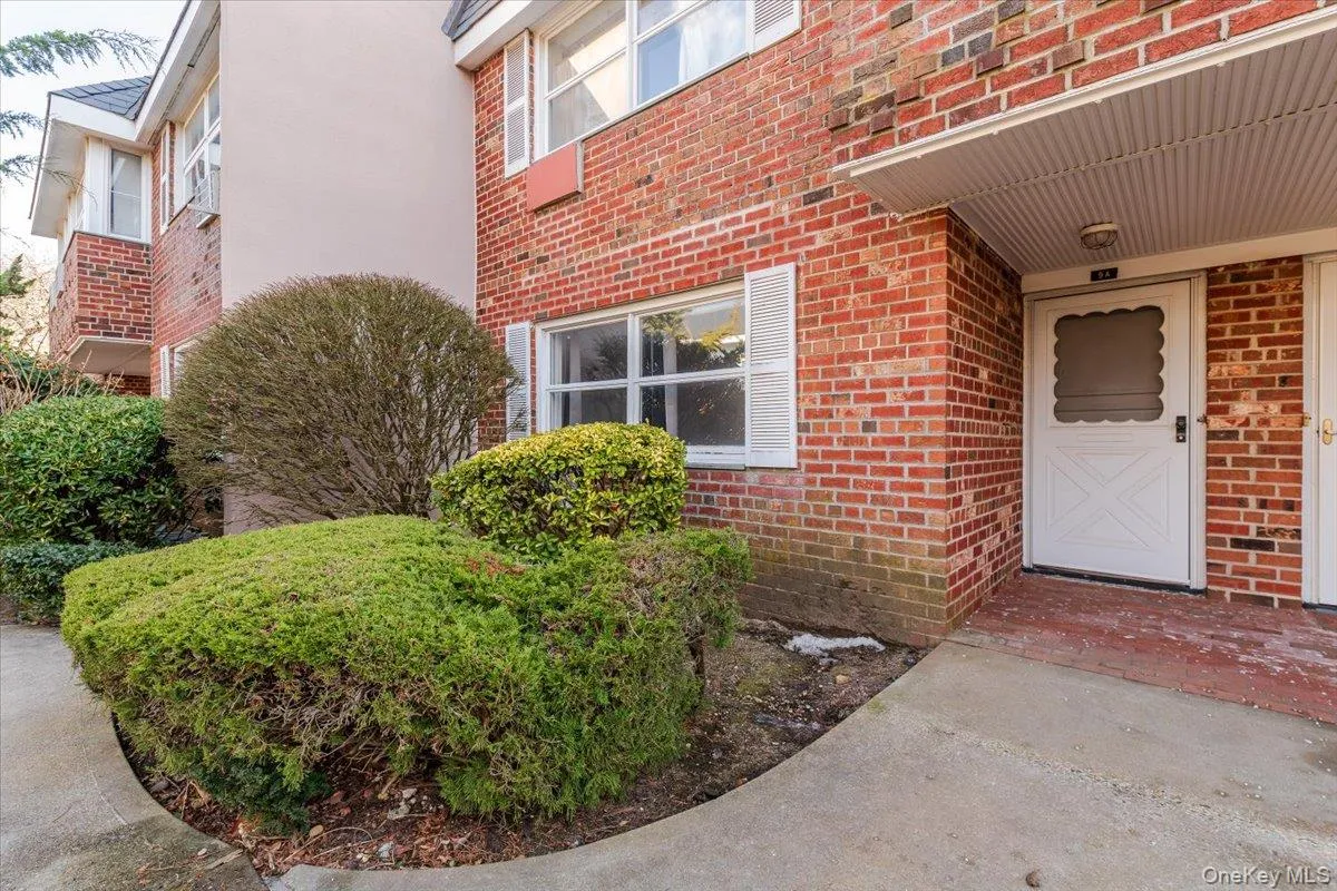 Doorway to property featuring brick siding Doorway to property featuring brick siding
