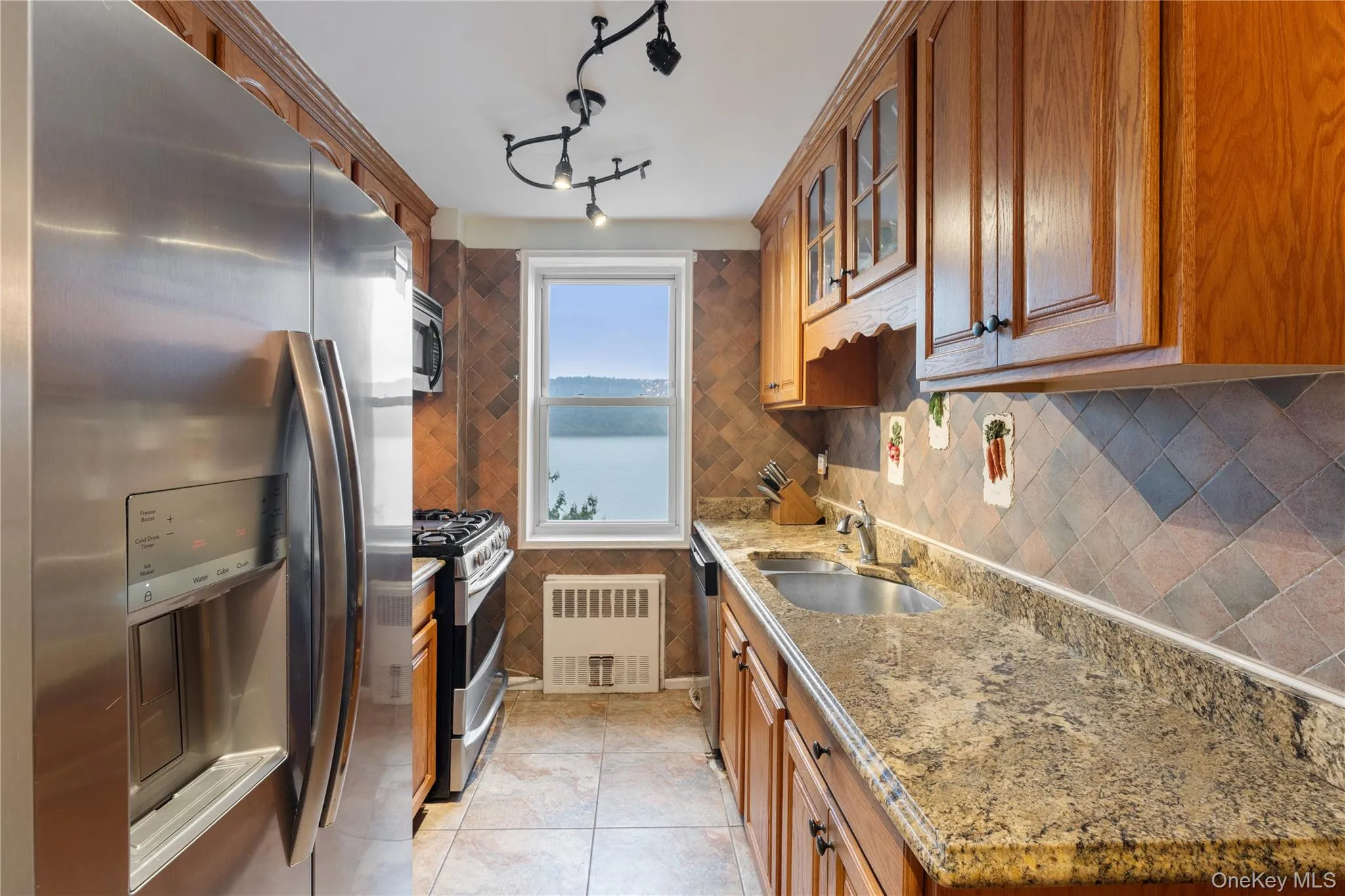 Kitchen with stainless steel appliances and river views Kitchen with stainless steel appliances and river views