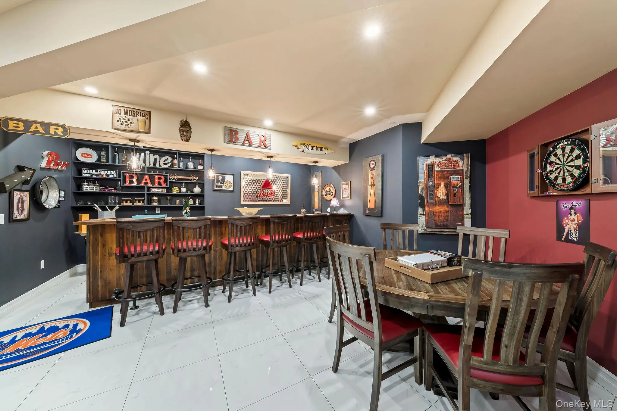 Custom wet bar featuring dark wood-finish cabinetry, recessed lighting, and large-format porcelain tile flooring Custom wet bar featuring dark wood-finish cabinetry, recessed lighting, and large-format porcelain tile flooring