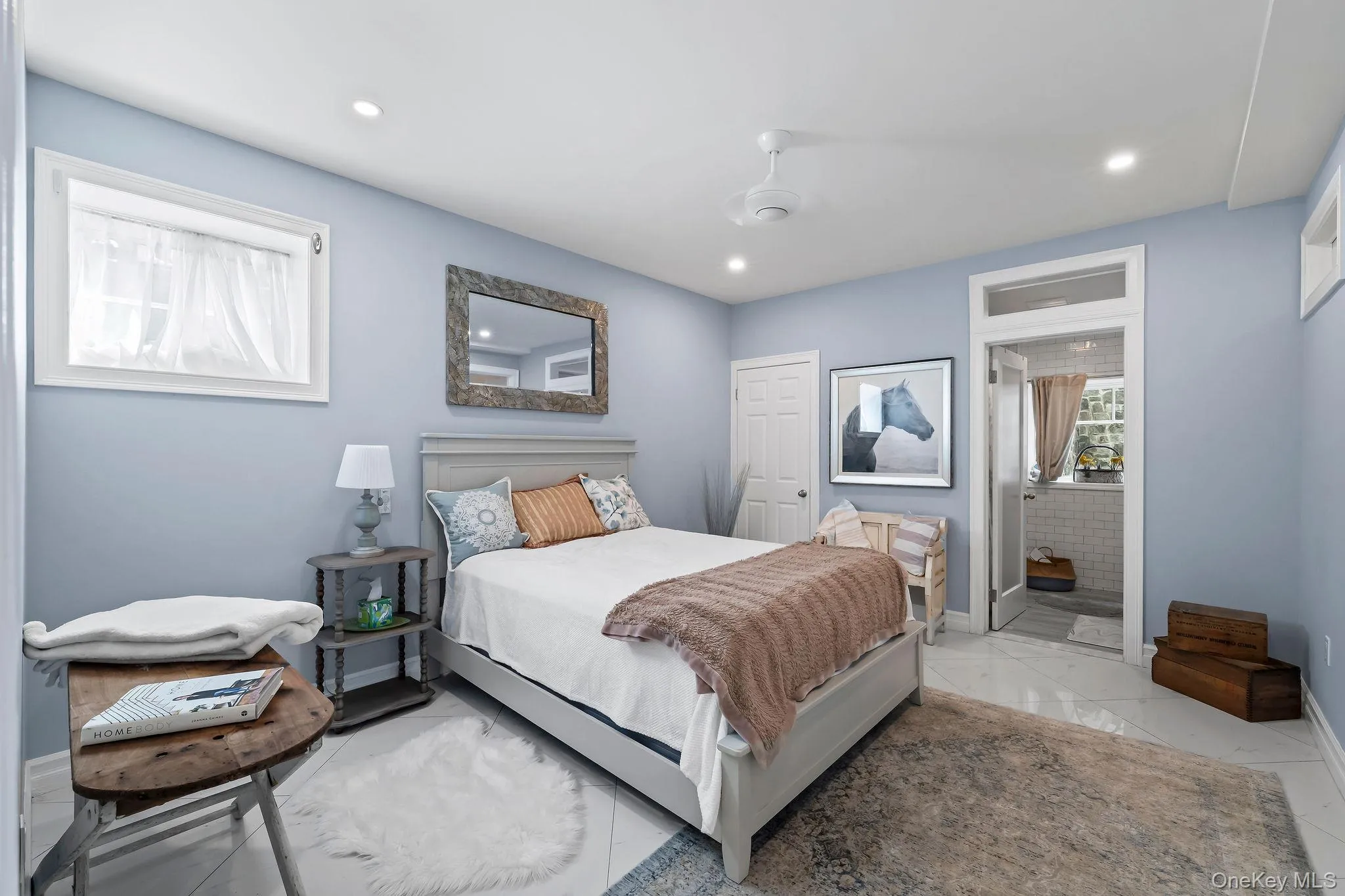 Recessed lighting, ceiling fan with integrated light, large-format tile flooring, and interior door with transom window Recessed lighting, ceiling fan with integrated light, large-format tile flooring, and interior door with transom window