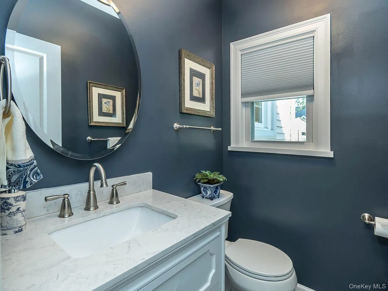 Half bath on first floor off of the family room/ den Half bath on first floor off of the family room/ den