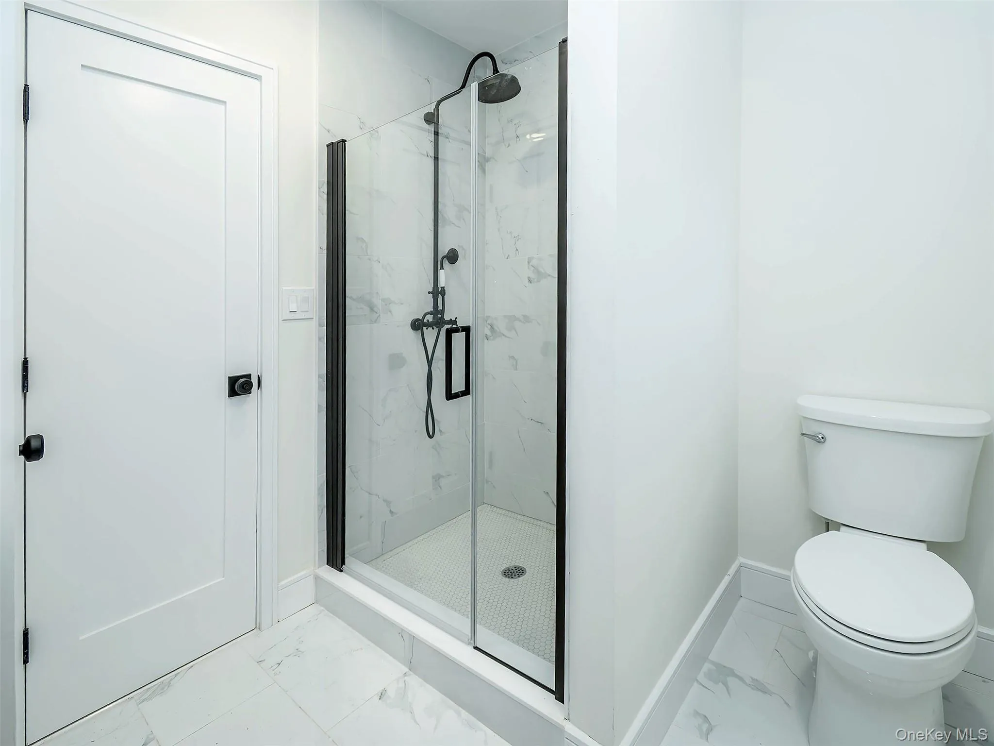 1st Floor: Primary bathroom with stall shower 1st Floor: Primary bathroom with stall shower