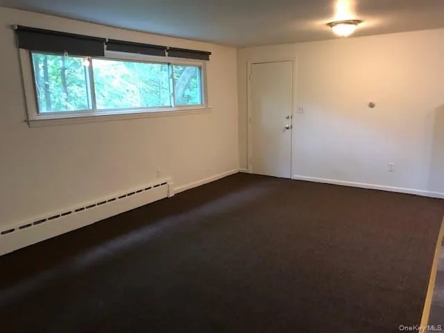 Spacious living & dining room looking toward the front door Spacious living & dining room looking toward the front door