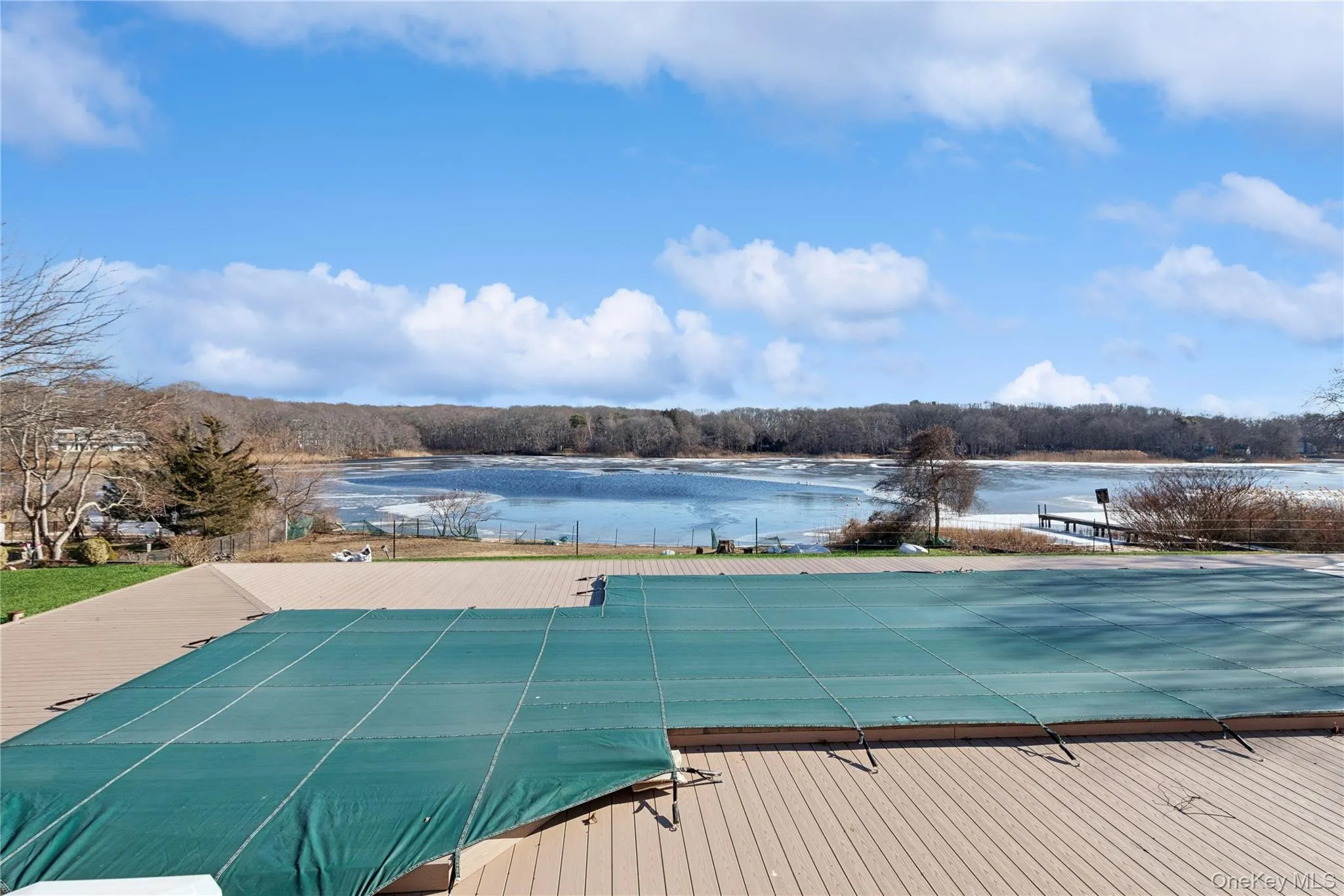 View of pool featuring a water view View of pool featuring a water view
