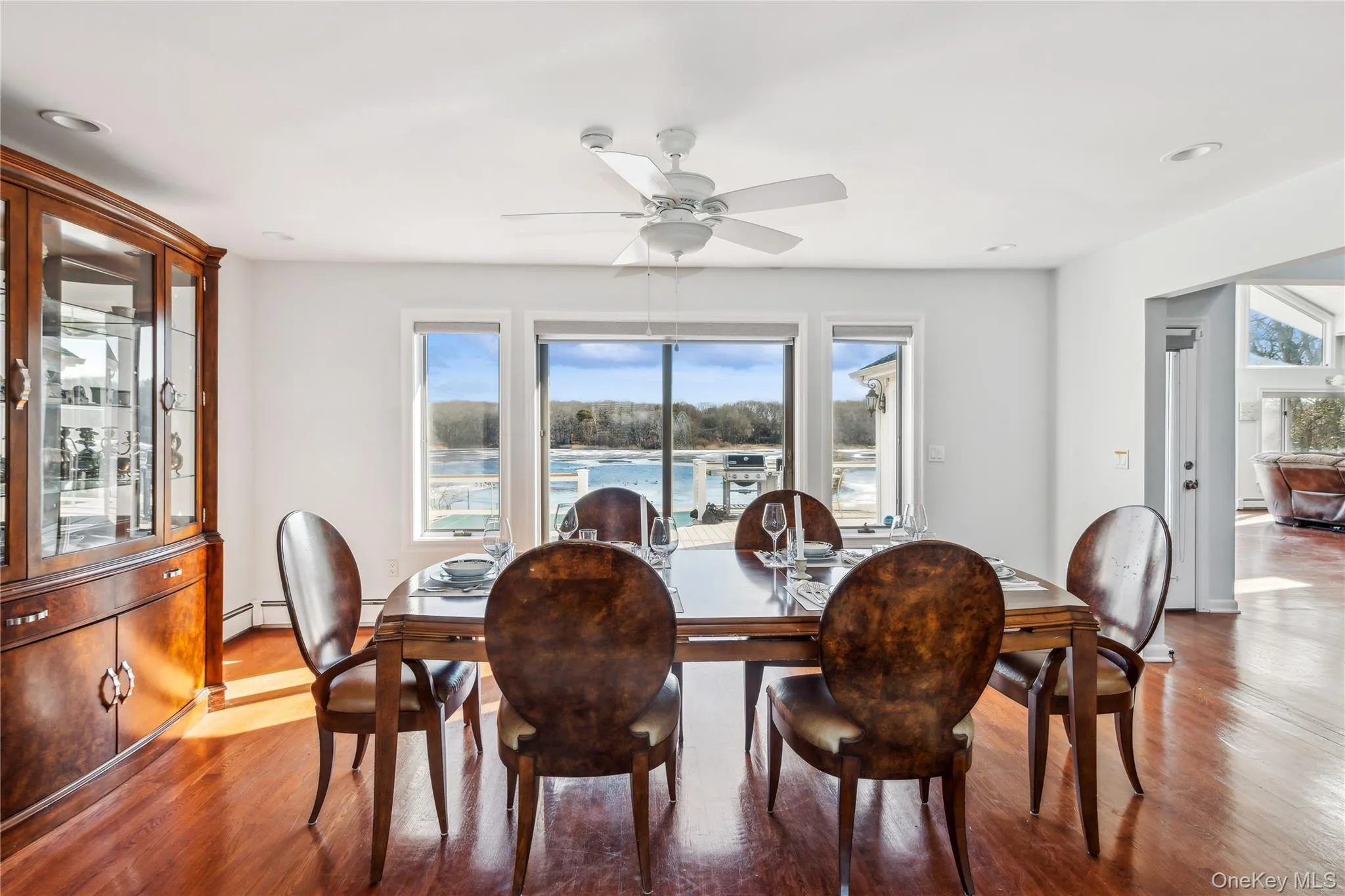 Formal Dining room hardwood / wood-style flooring, a wealth of natural light, and ceiling fan Formal Dining room hardwood / wood-style flooring, a wealth of natural light, and ceiling fan