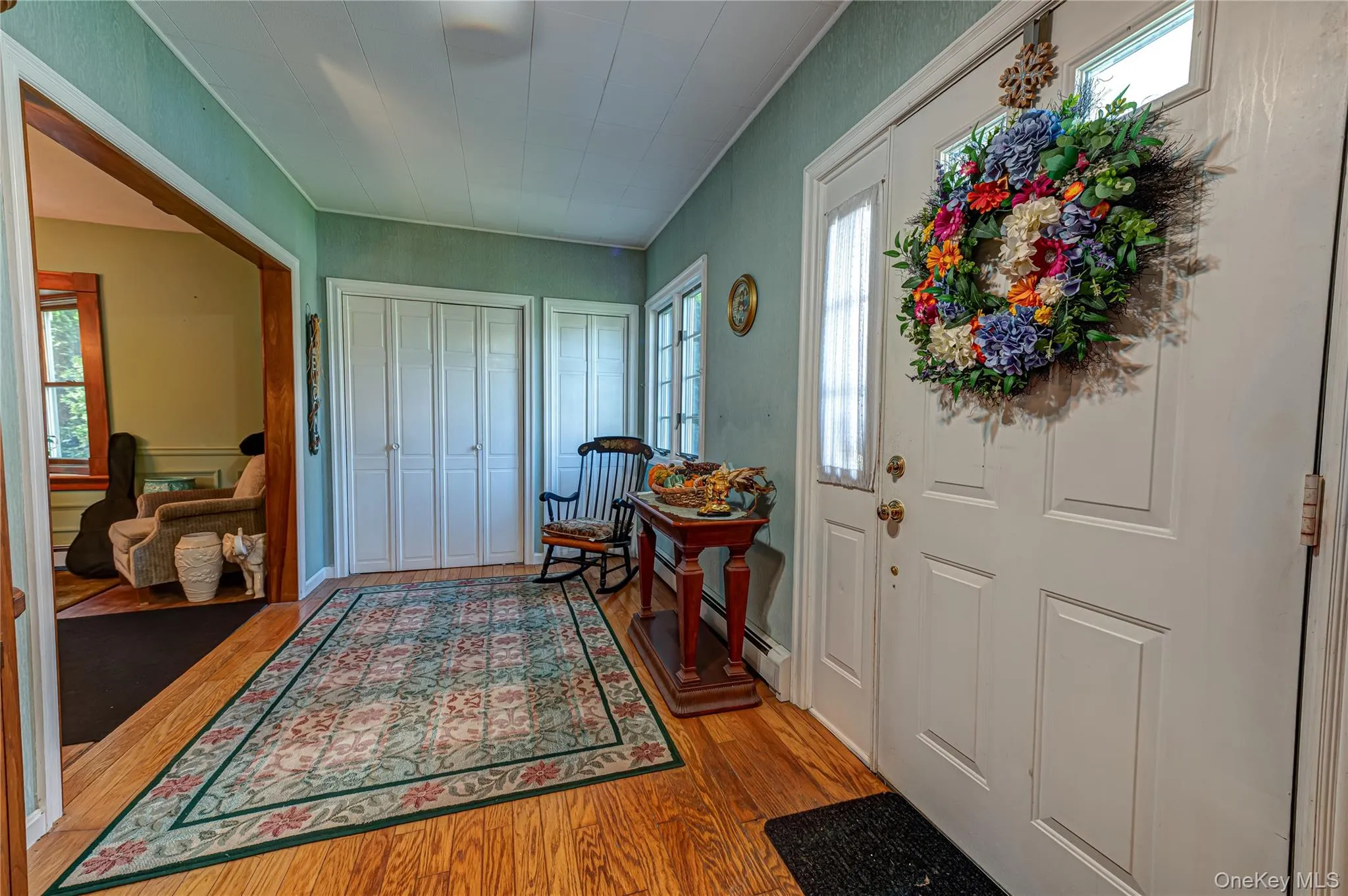 Entrance foyer with wall of closets! Entrance foyer with wall of closets!
