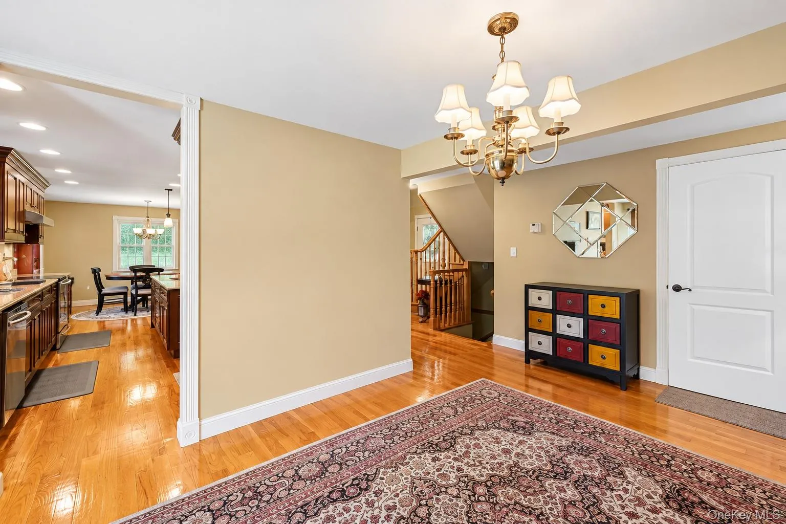 Den with entry to kitchen and foyer. Den with entry to kitchen and foyer.