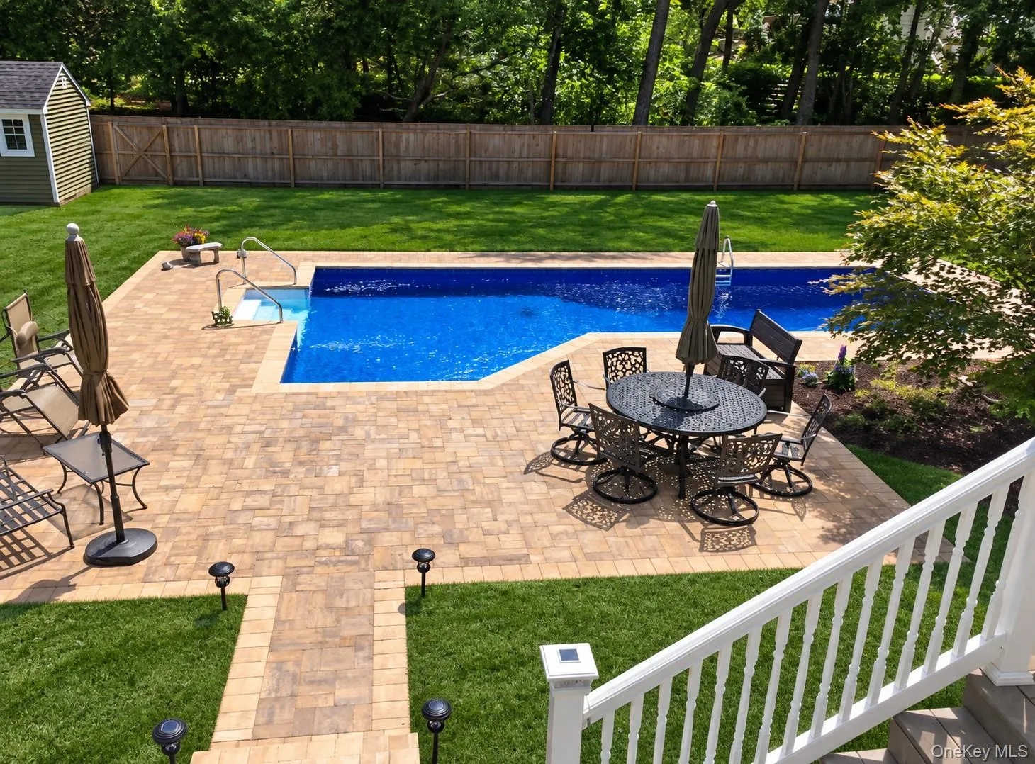 Summer view of Inground swimming pool and expansive back yard. Summer view of Inground swimming pool and expansive back yard.