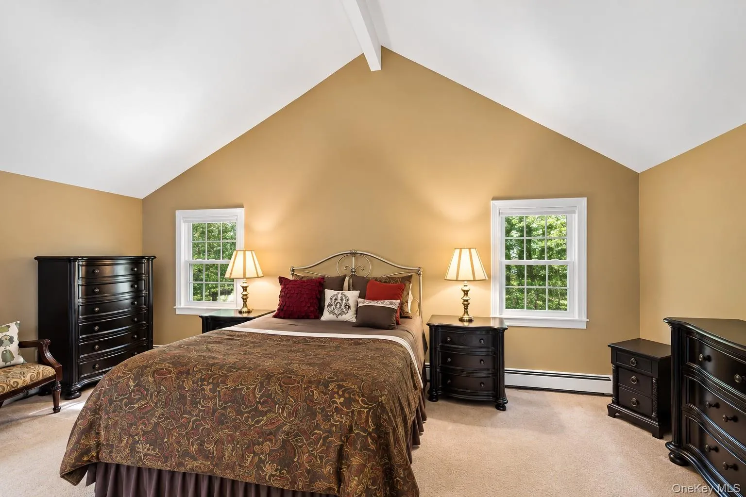 Primary bedroom with vaulted ceilings. Primary bedroom with vaulted ceilings.