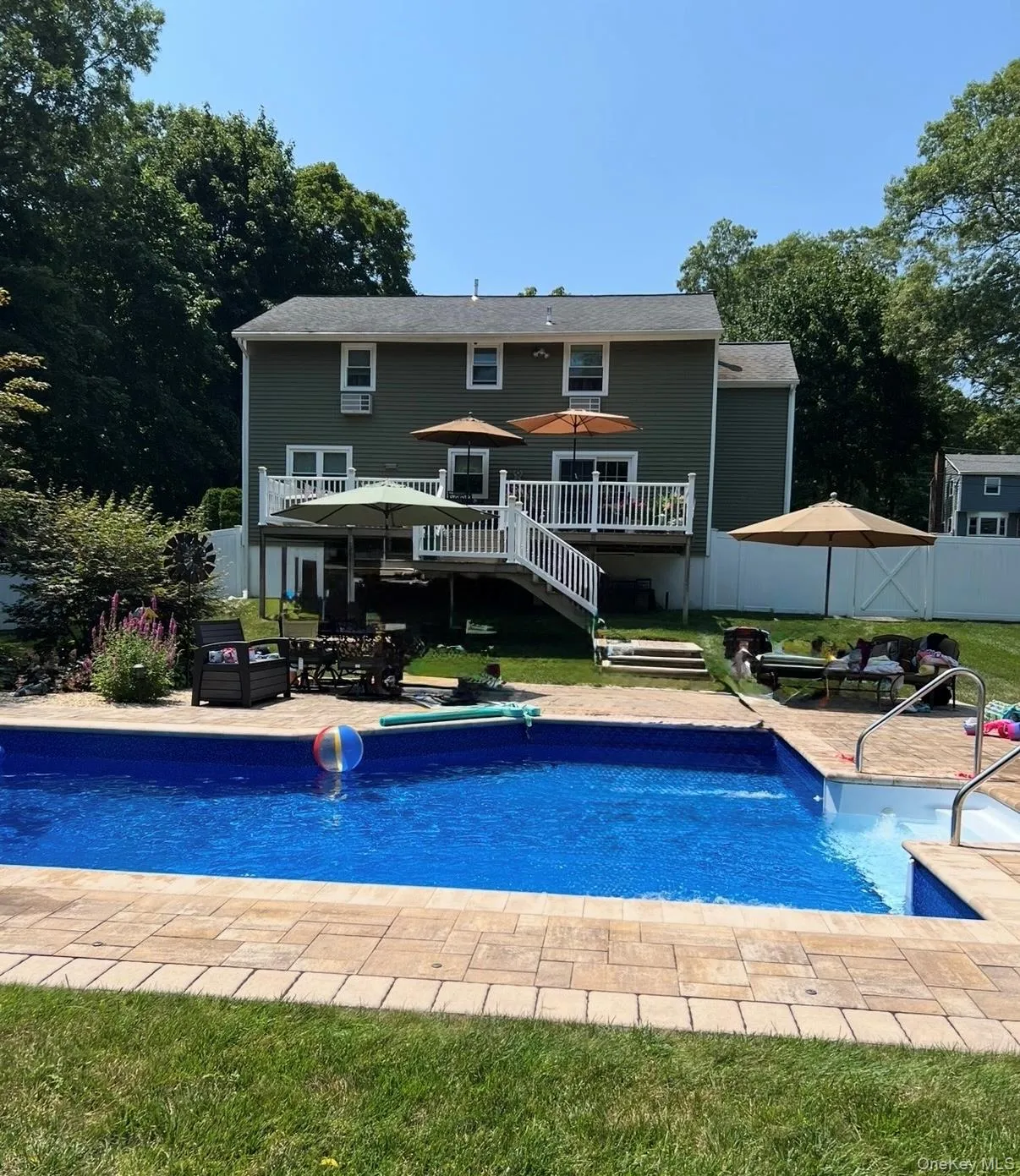 Summer view of Inground Swimming pool, 36x16x24 with loop lock cover. Summer view of Inground Swimming pool, 36x16x24 with loop lock cover.