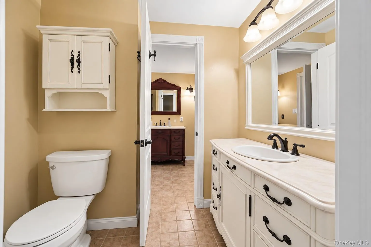 Separate Half bath from Primary bedroom, leading to the Full bathroom. Separate Half bath from Primary bedroom, leading to the Full bathroom.